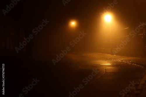 Foggy night street with public lighting 01