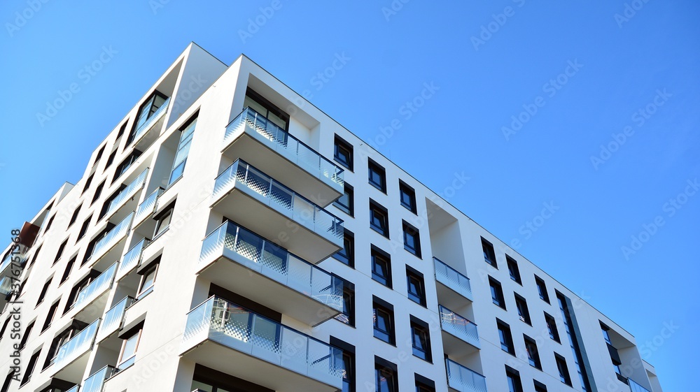 Architectural details of modern apartment building. Modern european residential apartment building complex. Architectural details of modern apartment building. Modern european residential apartment building complex.