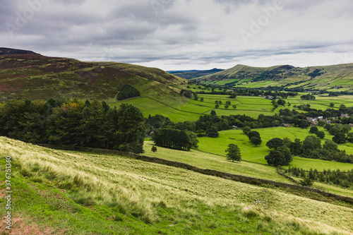 English countryside on a cloudy day. Green lush valley.