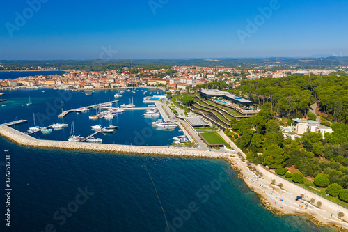 Aerial photo of hotels, beach and marina in Rovinj town, Istra, Croatia