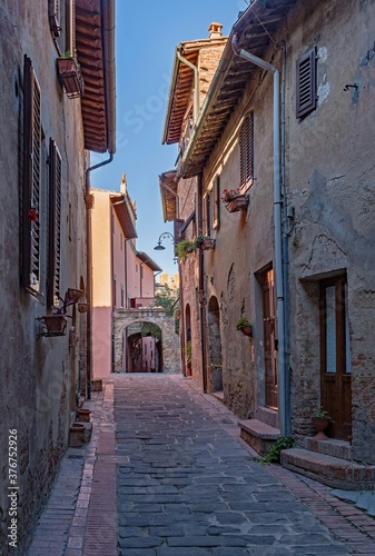 Narrow street at the old town of Certaldo, Tuscany Region in Italy  © Lapping Pictures