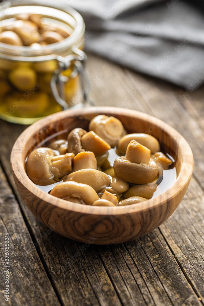 Pickled champignons. Marinated mushrooms Pickled champignons. Marinated mushrooms