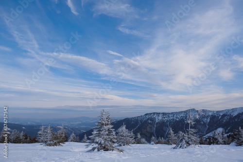 Beautiful winter mountain views during a snowshoe hike along the red ridge trail in the Low Tatras, Slovakia 