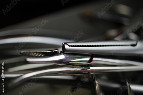 Macro closeup of surgical steel needle clamp