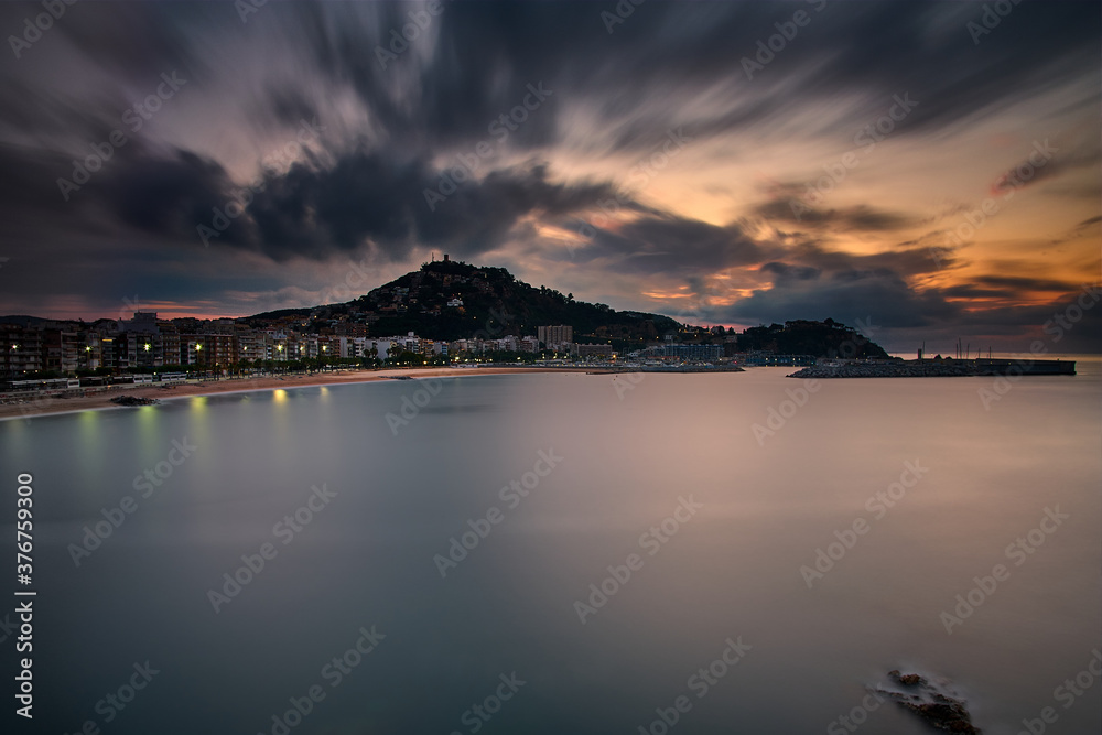 Sunrise in Blanes with moving clouds