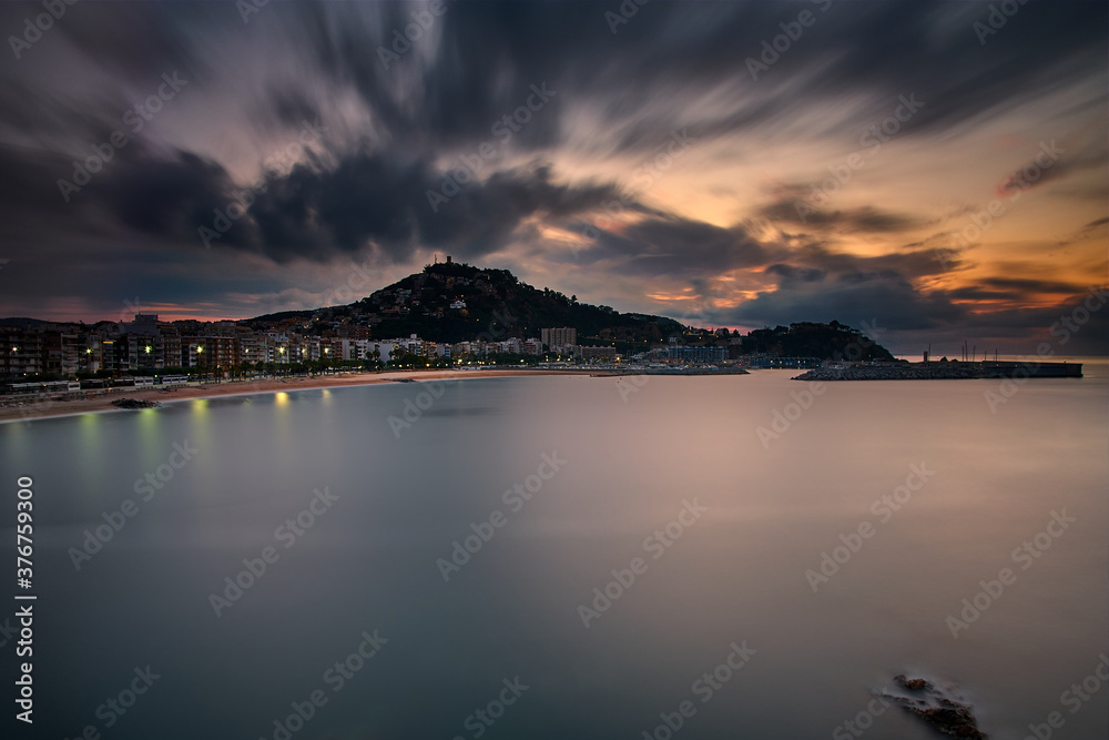 Sunrise in Blanes with moving clouds Sunrise in Blanes with moving clouds