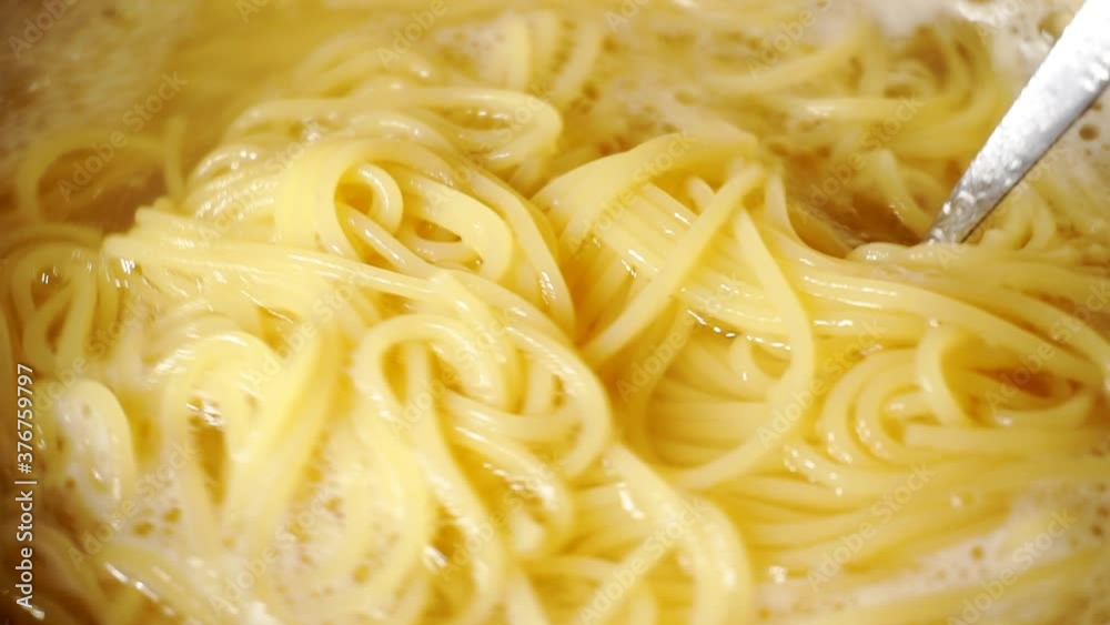 Close-up of spaghetti pasta In boiling hot water. Close-up of spaghetti pasta In boiling hot water.