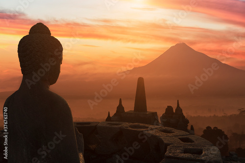 Buddha at sunset, The Buddhist Temple of Borobudur, Java, Indonesia