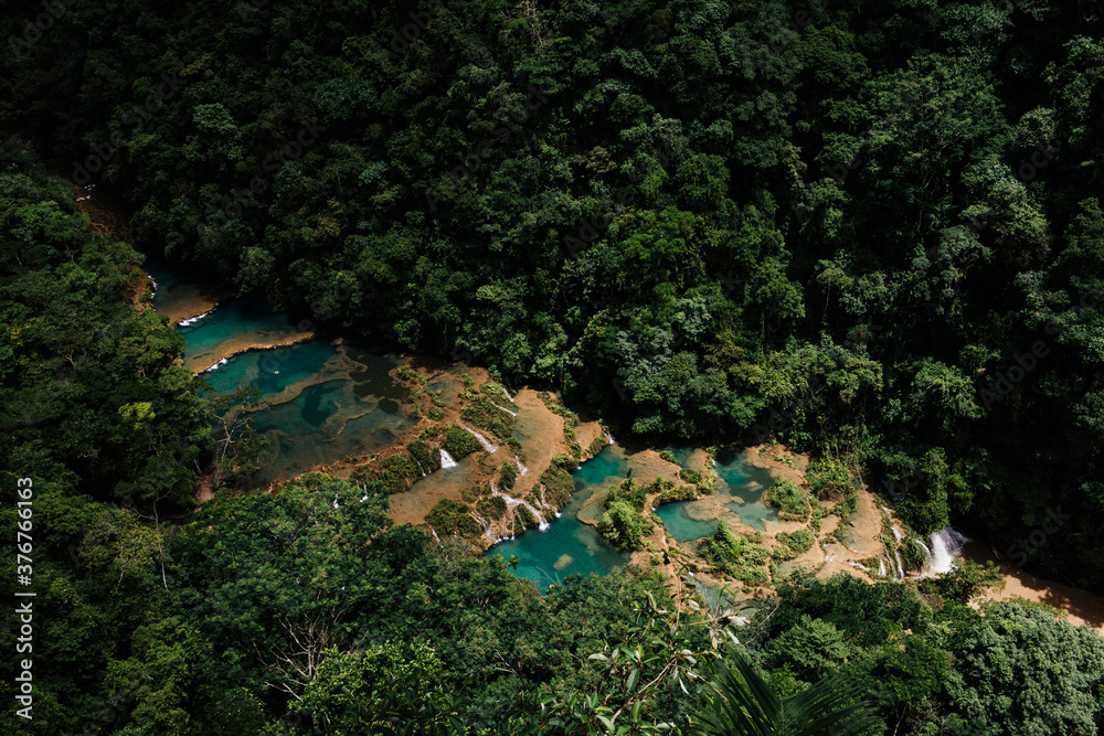 Aerial view of turquoise waterfalls in jungle, Semuc Champey, Alta Verapaz, Guatemala, Central America Aerial view of turquoise waterfalls in jungle, Semuc Champey, Alta Verapaz, Guatemala, Central America