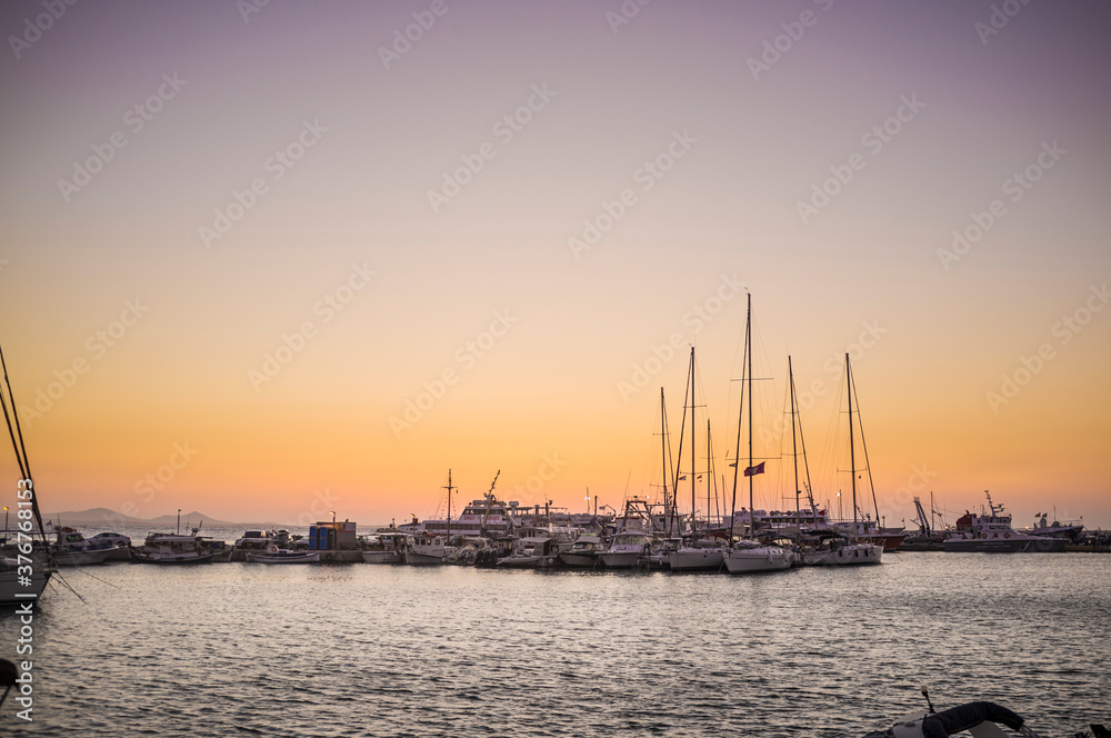 View of yachts and boats in marina at dusk, Naxos Island, Greece