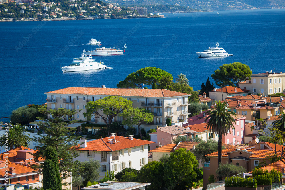 Elevated view of rooftops and coast, St Jean Cap Ferrat, France