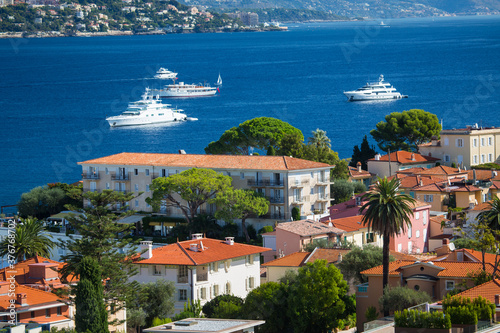 Elevated view of rooftops and coast, St Jean Cap Ferrat, France photo