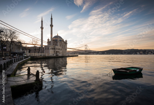 Exterior of Ortakoy Mosque and Bhosphorus bridge at dawn, Ortakoy, Istanbul, Turkey photo