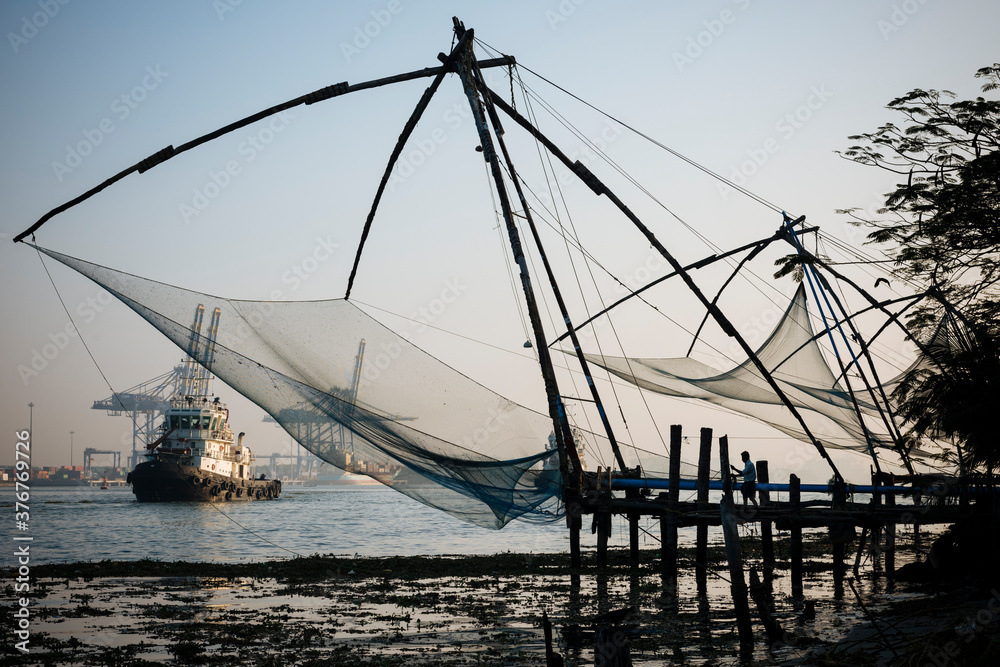 Fishing nets, boat in background, Fort Kochi (Cochin), Kerala, India