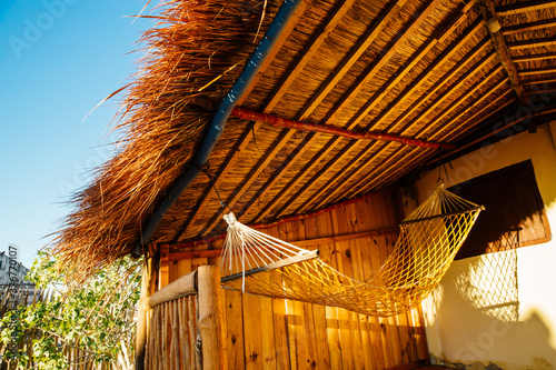 Empty hammock outside traditional hotel building, Toliara, Madagascar, Africa photo