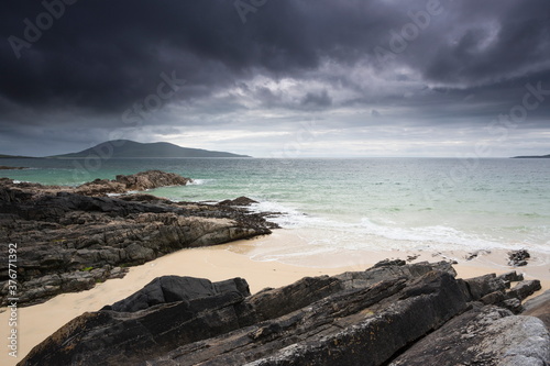 Looking south west over Sound of Taransay towards headland of Ceapabhal from Geodh Mhartainn near Borve, South Harris, Outer Hebrides, Scotland photo