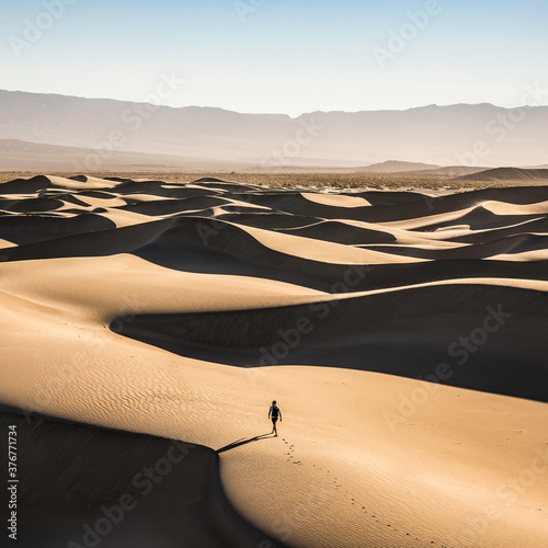 High angle view of man walking on sand dunes in Mesquite Flat Sand Dunes photo