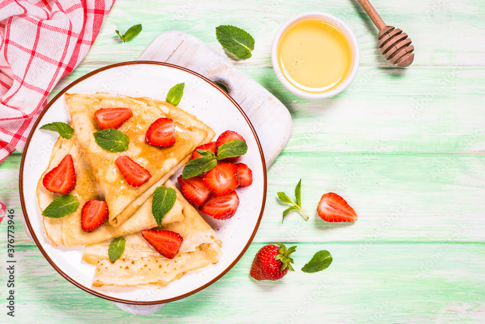 Crepes with fresh srawberries and honey. Crepes with fresh srawberries and honey.
