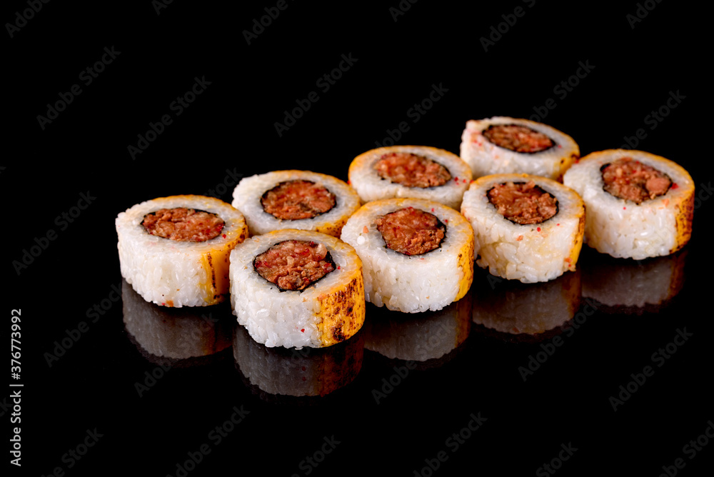 Fresh sushi rolls prepared from the best varieties of fish and seafood Fresh sushi rolls prepared from the best varieties of fish and seafood