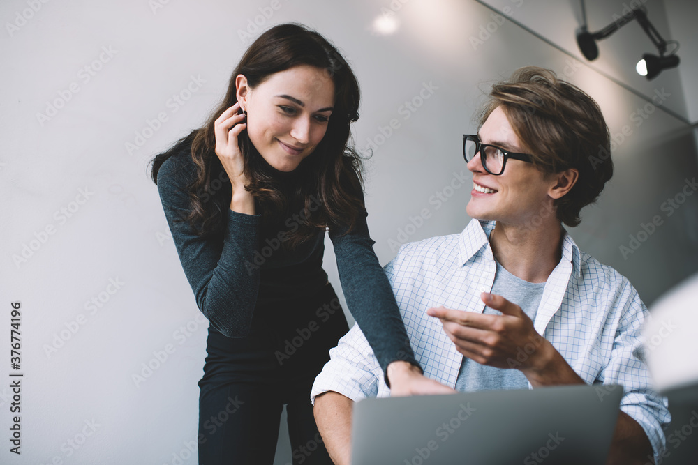 Managers with laptop discussing project Managers with laptop discussing project