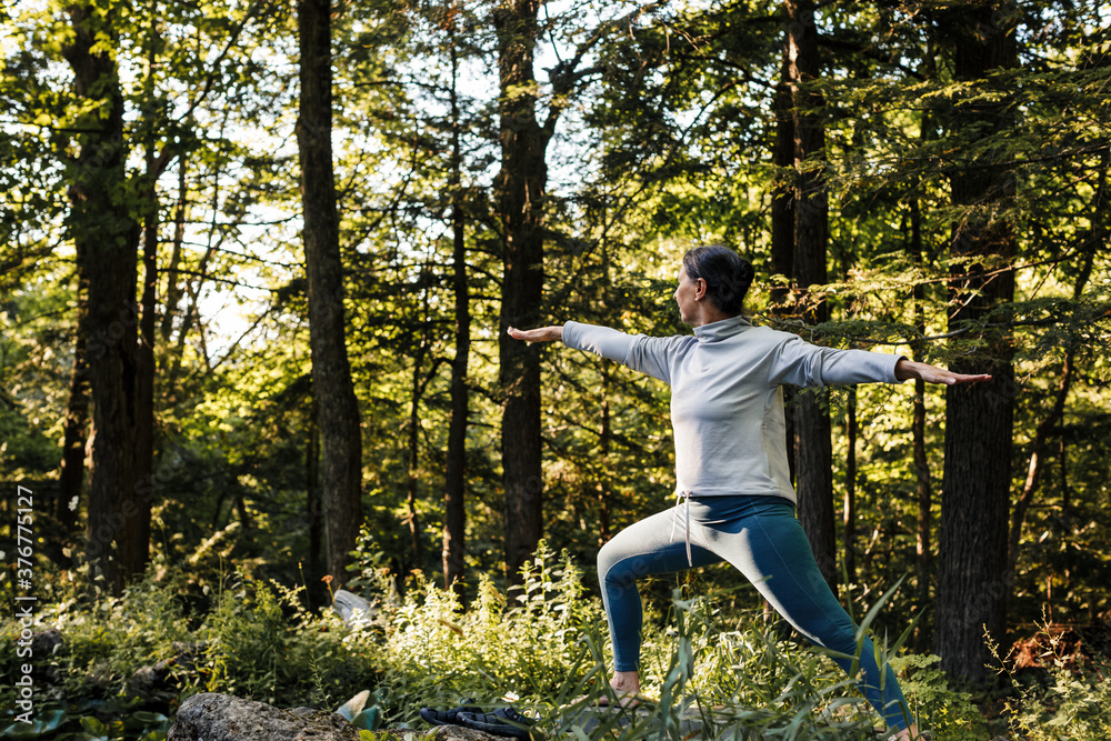 Senior woman doing yoga outdoors Senior woman doing yoga outdoors