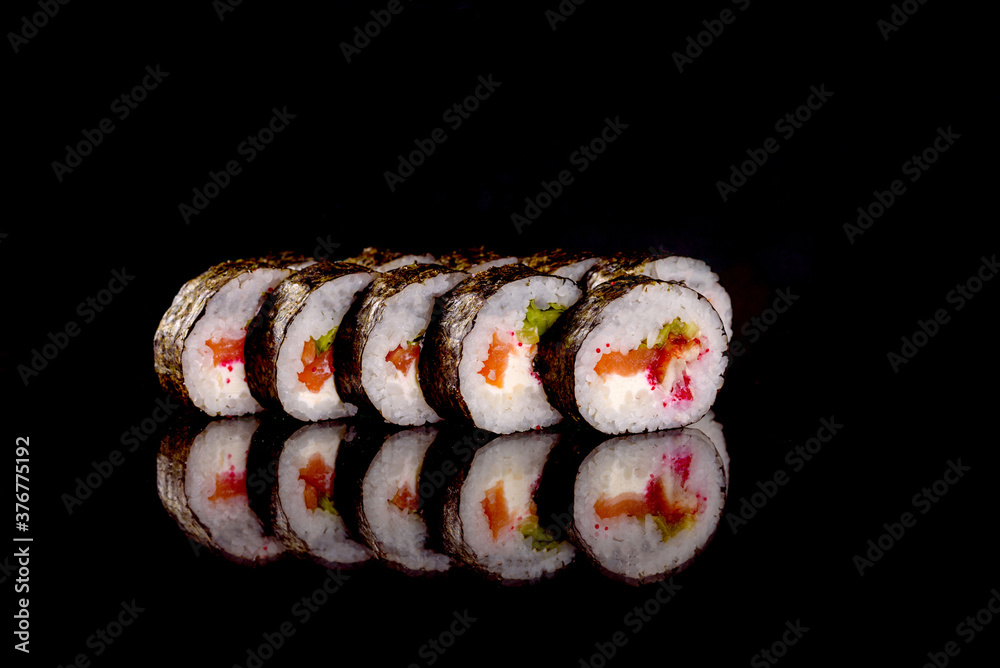 Fresh sushi rolls prepared from the best varieties of fish and seafood Fresh sushi rolls prepared from the best varieties of fish and seafood