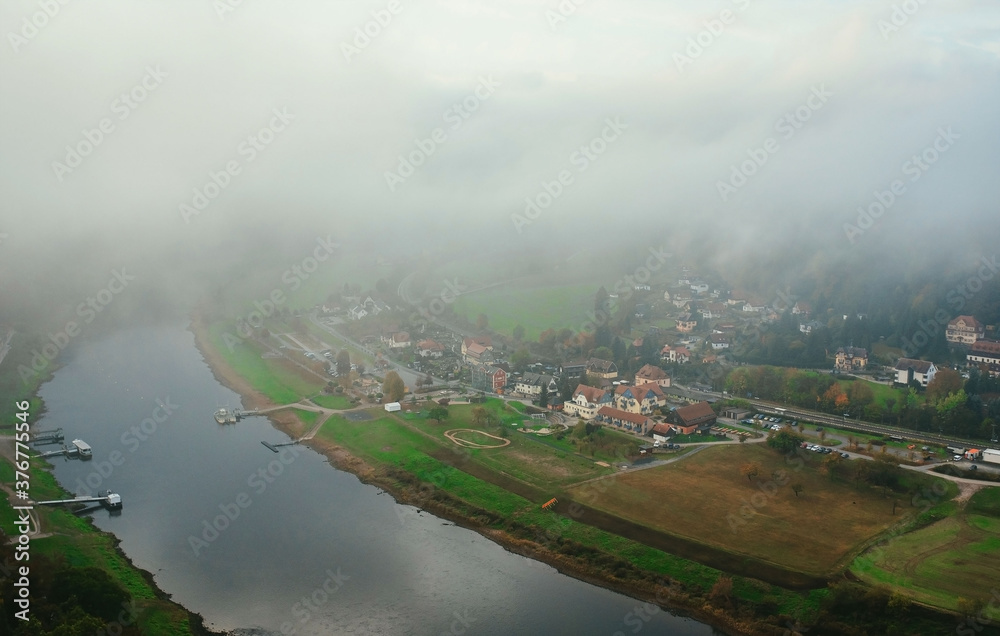 beautiful top view of the river and the village through the clouds in the morning beautiful top view of the river and the village through the clouds in the morning