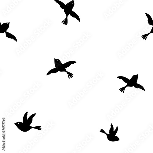 Simple vector graphic monochrome seamless repeat pattern with little black birds flying on a white background 
