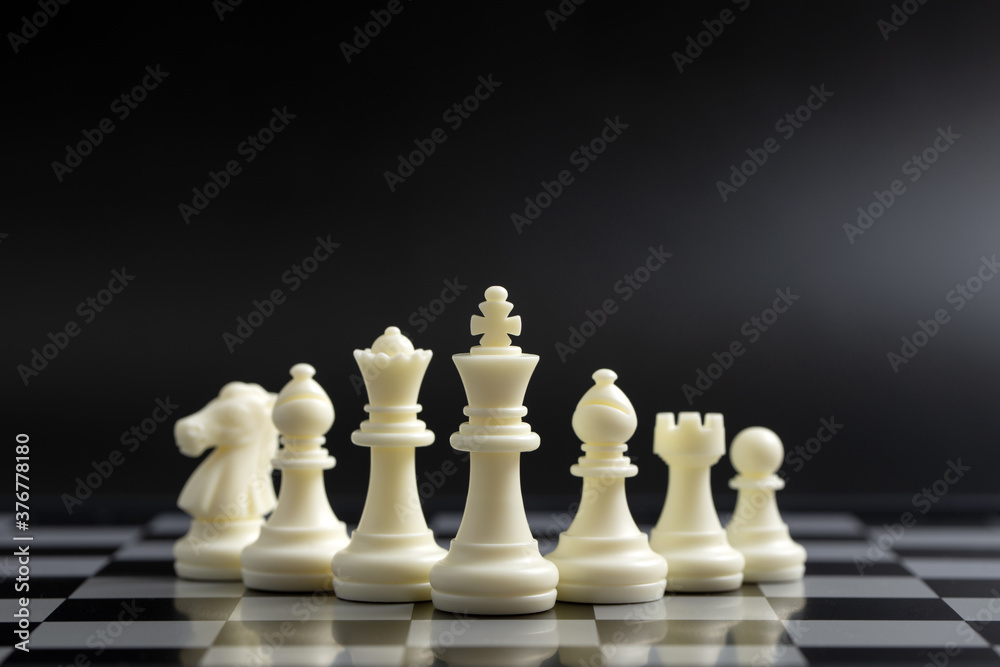 White chess pieces on the board for business or team strategy planning concept