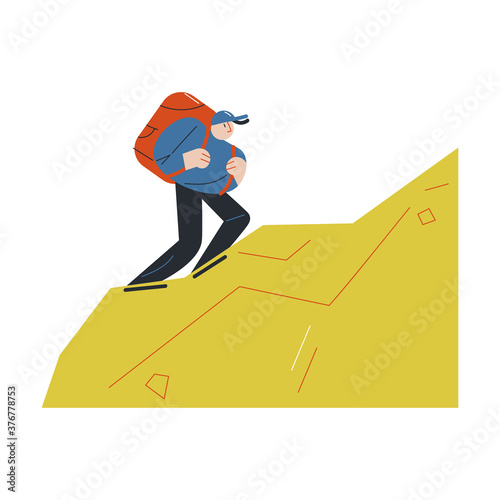 Young man with backpack climbing up natural hill