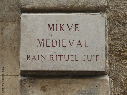 Medieval Mikveh Marble Sign on stone wall in old european city