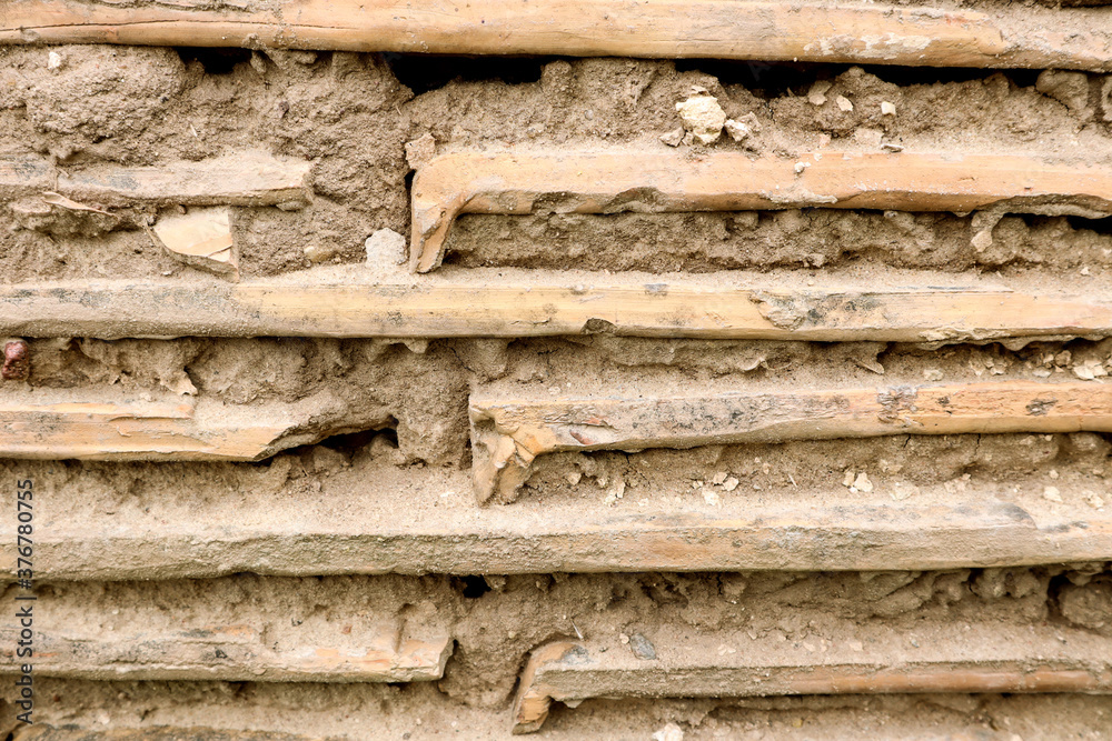 Background of old tiles with cement mortar, close-up, side view Background of old tiles with cement mortar, close-up, side view