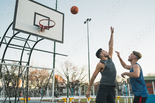Young basketball players playing one-on-one. © Mego-studio