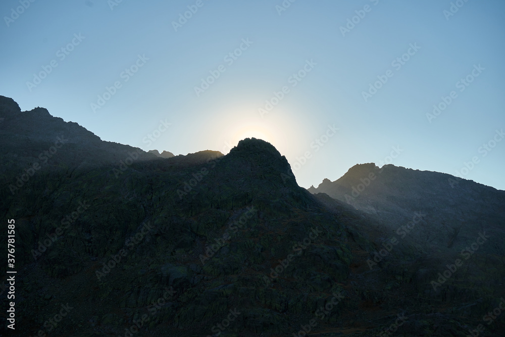 Sun rays behind the mountain