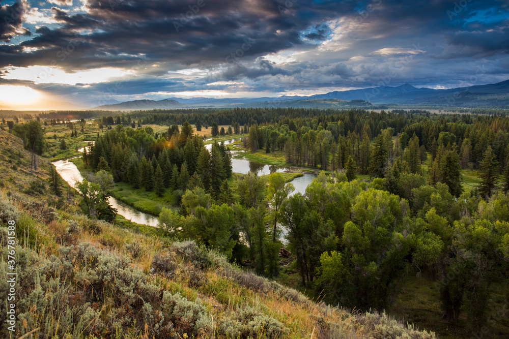 Scenic view of Snake River against cloudy sky during sunrise Scenic view of Snake River against cloudy sky during sunrise