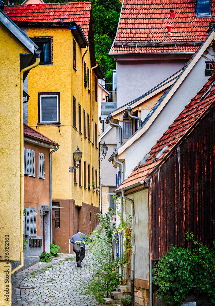 Unidentified man walks up cobbled street in Esslingen-