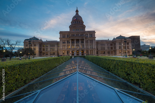 Exterior view of Texas State Capitol building against cloudy sky photo