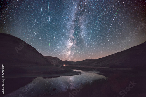 Milky Way and Meteor shower reflecting in John Day River in Cottonwood Canyon State Park photo