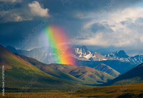 Scenic view of rainbow over Alaska Range in Denali National Park and Preserve