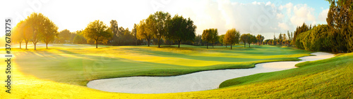 View of golf course during sunrise