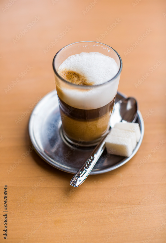 Close up of coffee with sugar cubes on table Close up of coffee with sugar cubes on table