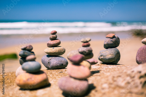 View of cairns on beach photo