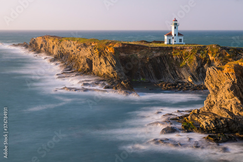 View of Cape Arago Lighthouse during sunset photo
