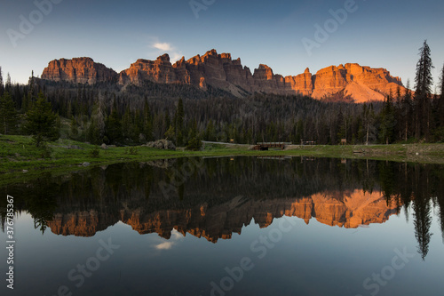 Reflection of Absarokas mountain range in lake photo