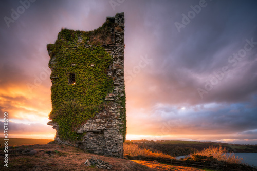 Old castle on coast during sunset