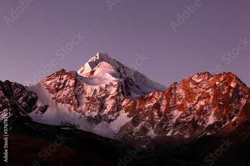 Scenic view of Mount Huayna Potosi covered with snow at twilight