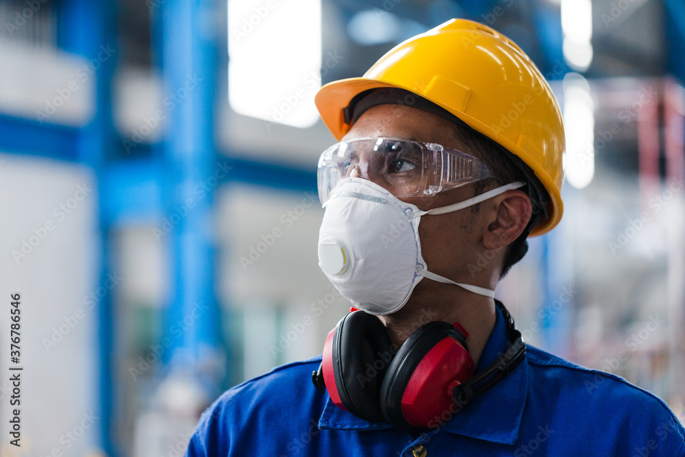 Skilled Asian worker with protective mask Skilled Asian worker with protective mask