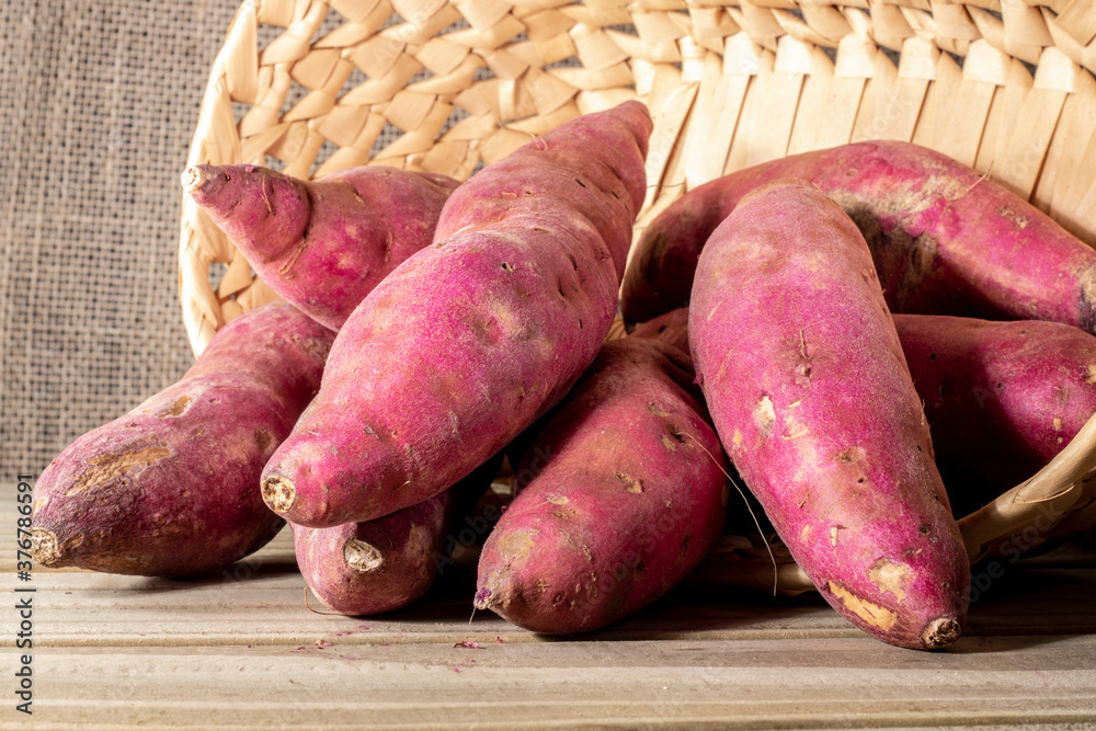 Sweet potato in basket on jute background in Brazil Sweet potato in basket on jute background in Brazil