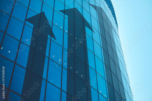 Business growth concept with abstract arrows on building