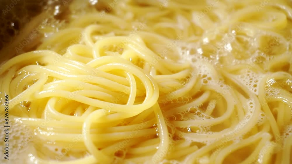 Close-up of spaghetti pasta In boiling hot water. Close-up of spaghetti pasta In boiling hot water.